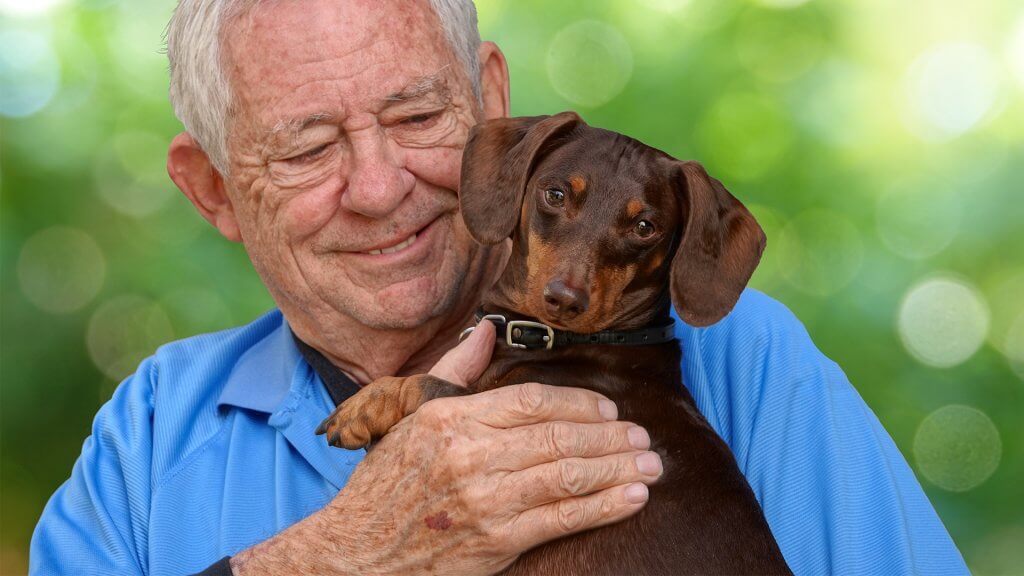 Elderly man and dog