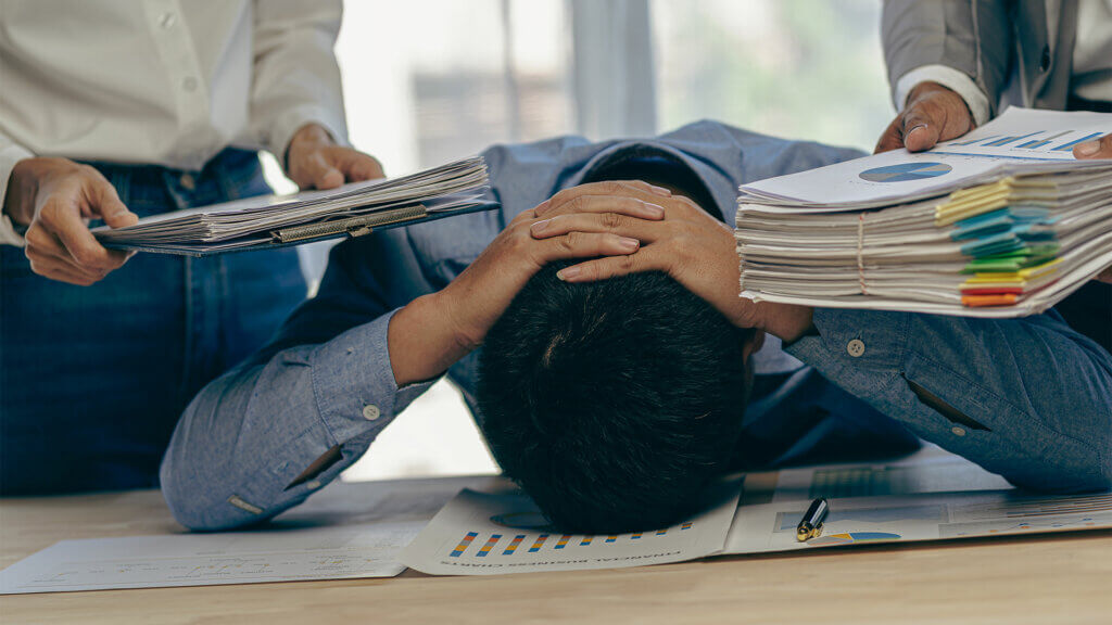 Businessman stressed with casual office work, stress, headache and anxiety