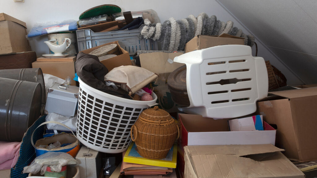 Pile of junk in a house, hoarder room pile of household equipment needs clearing out